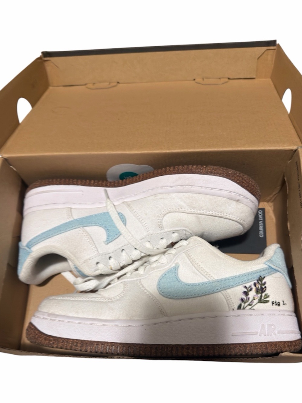 Nike Women's White Sneakers with Light Blue Swoosh and Floral Detail